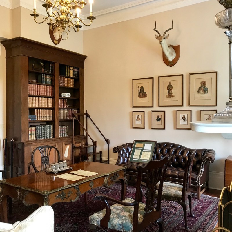 a living room filled with furniture and a fire place