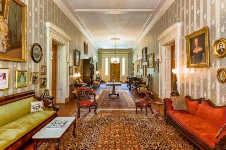 a living room filled with furniture and a fireplace