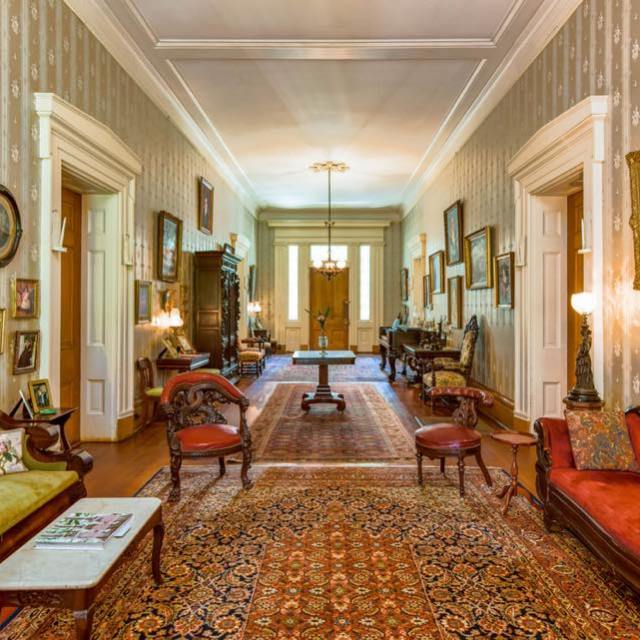 a living room filled with furniture and a fireplace
