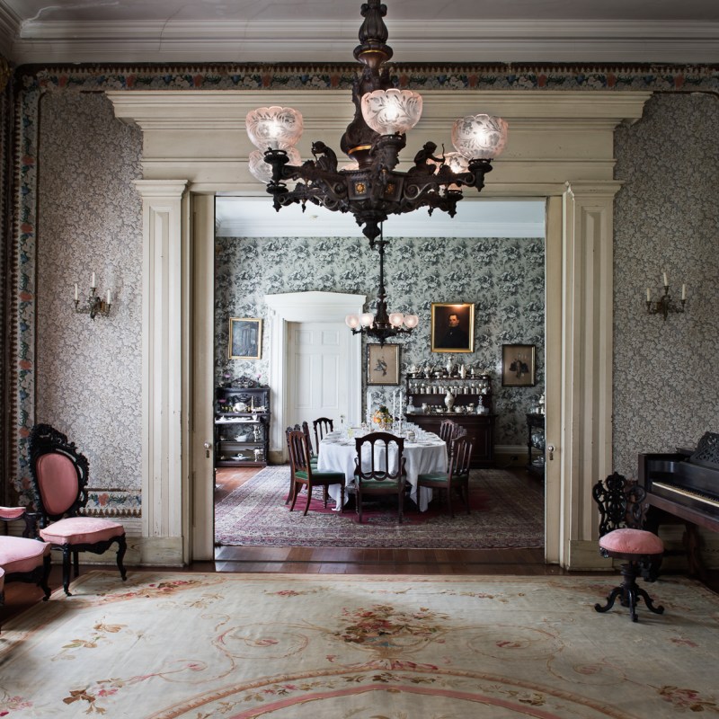 a room filled with furniture and a fireplace