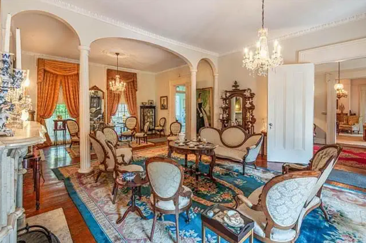 a living room filled with furniture and a fireplace