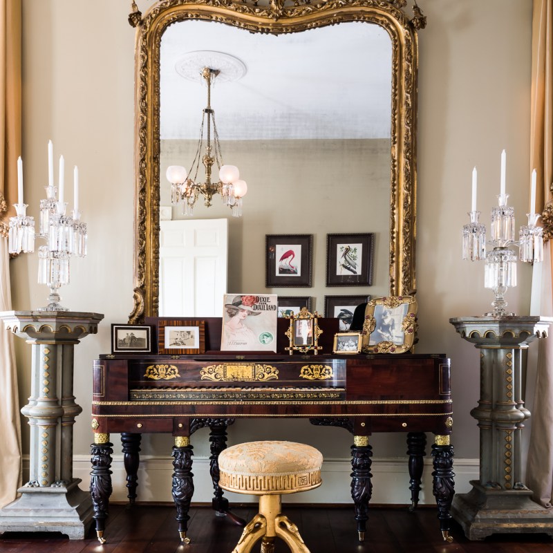 a room filled with furniture and vase on a table