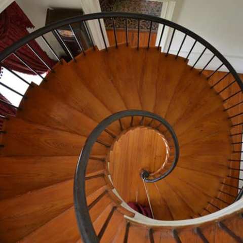 a bicycle sitting on top of a wooden chair