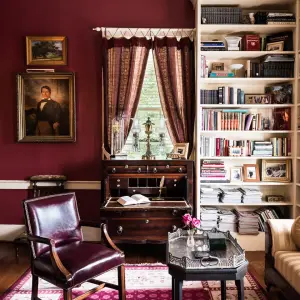 a living room filled with furniture and vase on a table