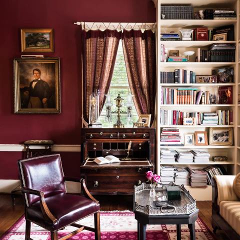 a living room filled with furniture and vase on a table