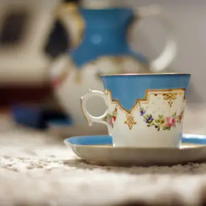 a close up of a blue cup sitting on a table