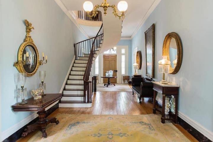 a living room filled with furniture and a fireplace