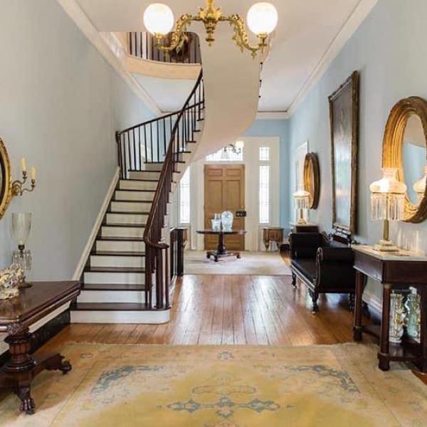 a living room filled with furniture and a fireplace