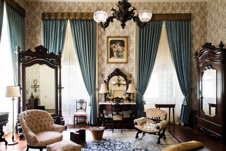 a living room filled with furniture and a fireplace