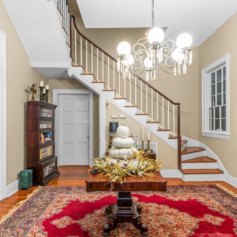 a living room filled with furniture and a fire place