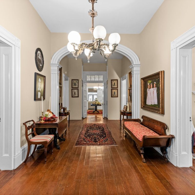 a living room filled with furniture and a fire place
