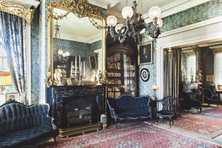 a living room filled with furniture and a fireplace