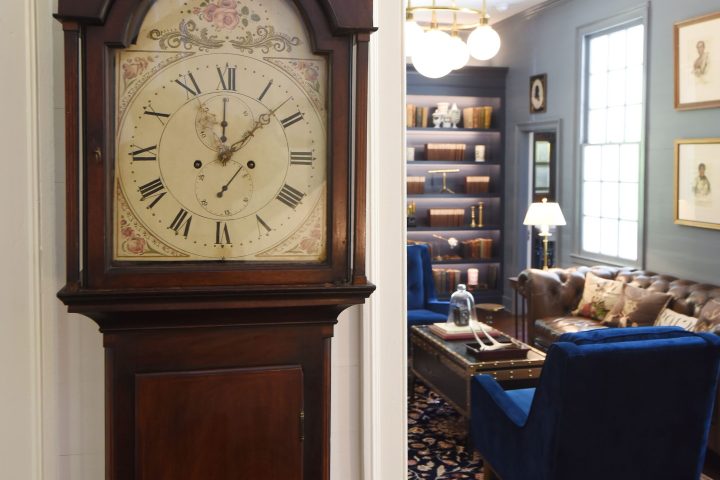 a clock sitting in the middle of a room