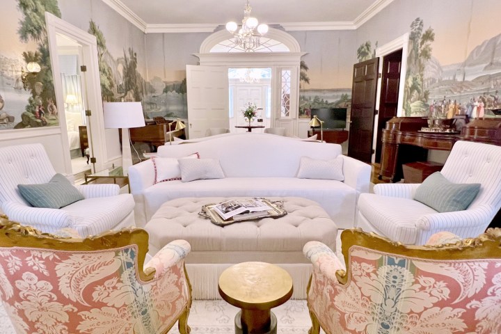 a living room filled with furniture and a fireplace