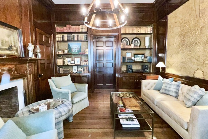 a living room filled with furniture and a large window