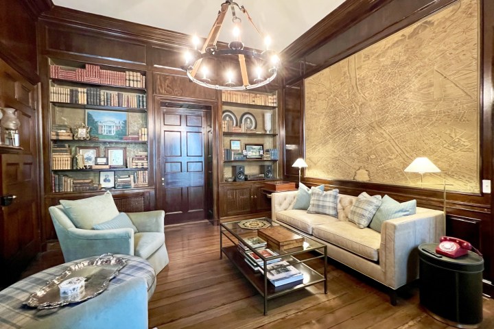 a living room filled with furniture and a large window