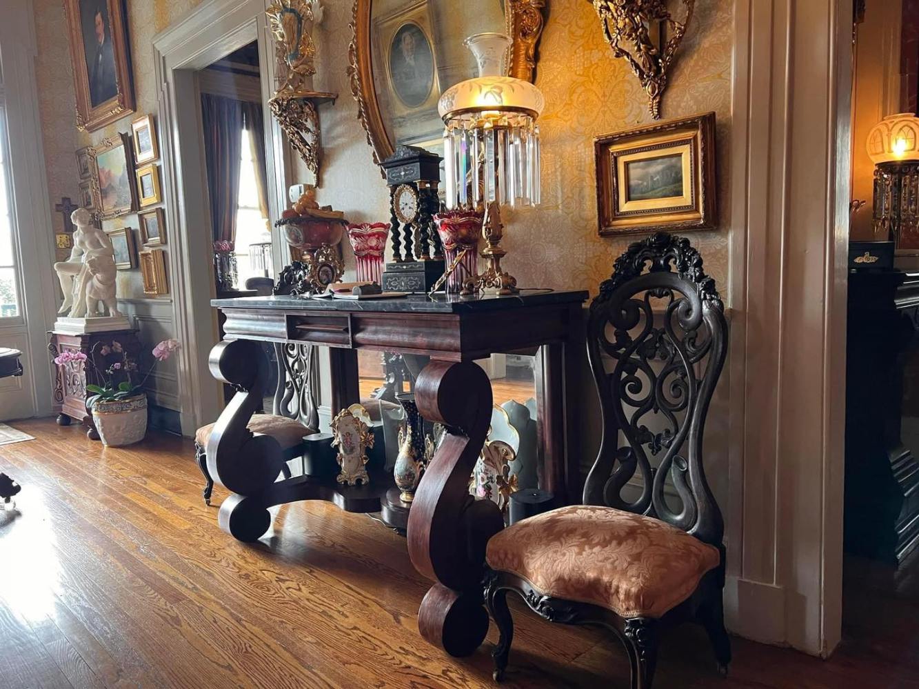 a living room filled with furniture and a mirror