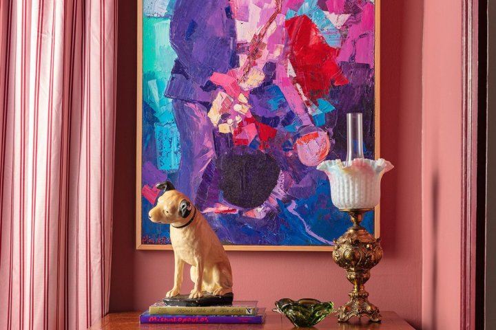 a teddy bear in front of a curtain