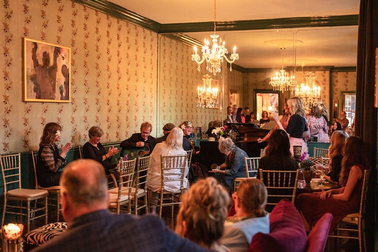 a group of people sitting at a table in a restaurant